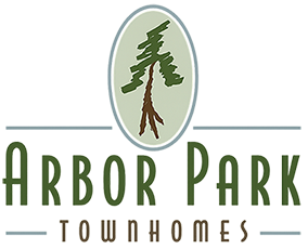 Arbor Park Townhomes horizontal logo with oval evergreen tree emblem and green typography on transparent background.